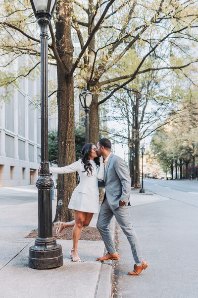 man hugging woman from behind