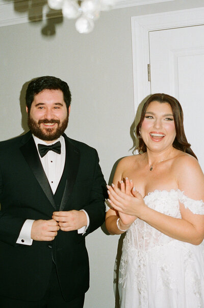 Film flash photo of bride and groom smiling and laughing at their Blue Hill at Stone Barns wedding.