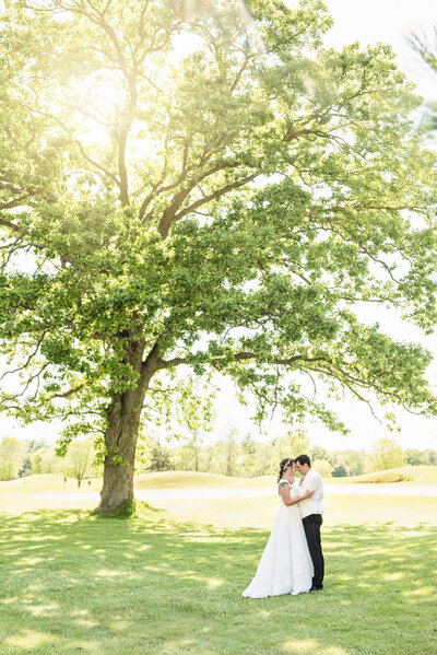 Wedding Couple on golf course by Lake Geneva Wedding Photographer, Allysha Noelle Photography
