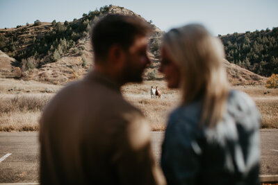Engagement and wedding photography at Theodore Roosevelt National Park, Medora, ND, showcasing couples in the stunning Badlands landscape. Perfect for adventurous couples seeking dramatic backdrops and timeless moments.