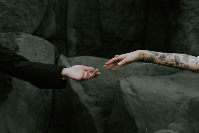 hands at black sand beach Iceland