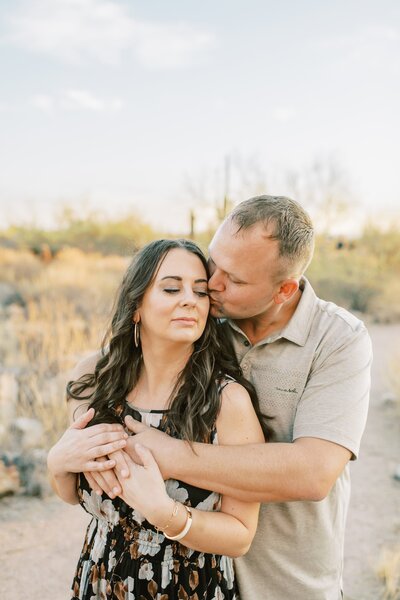 couple posing for a photo at scottsdale az desert