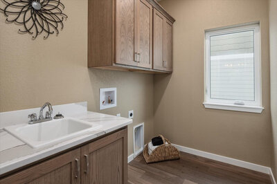 laundry room with stone countertops