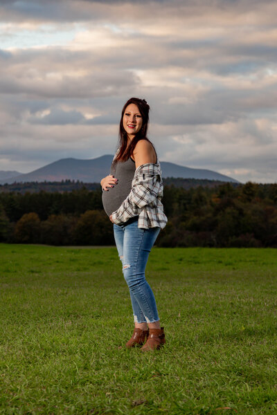 Maternity Photo of Mom in Field with Mountain