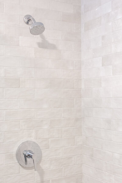 The bathroom features 2x8 Zellige ceramic tiles.