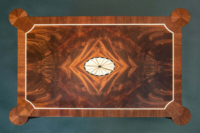 a traditional four way bookmatched veneer tabletop with fan  | Heller and Heller Furniture
