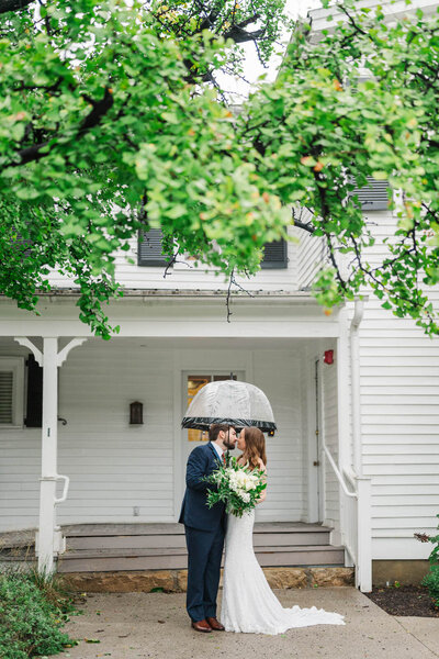 Bride and groom embrace during their wedding portraits at The Jim Beam Distillery
