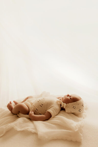 Newborn girl posed on blanket in Yukon, Oklahoma