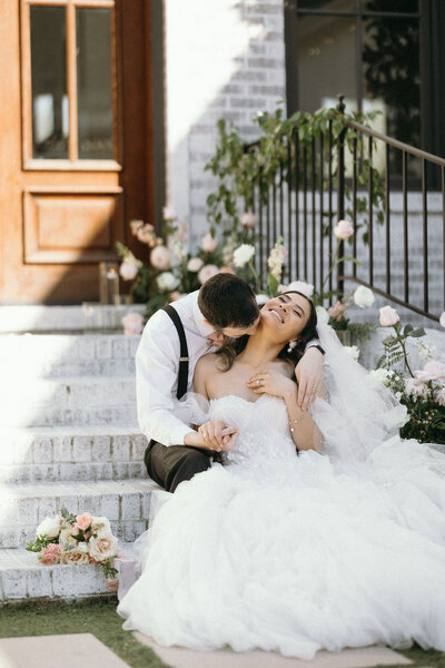 Couple holding hands and looking off into the distance.