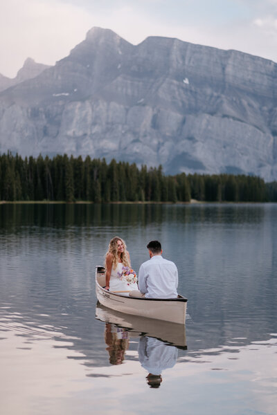 Couple canoeing on a lake in Banff