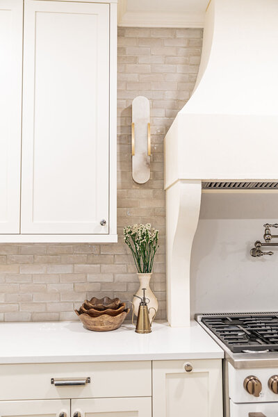 Upscale kitchen design in Brookhaven, Georgia featuring custom cabinetry, quartz countertops, and a timeless, functional layout by Megan Paterson Interiors.