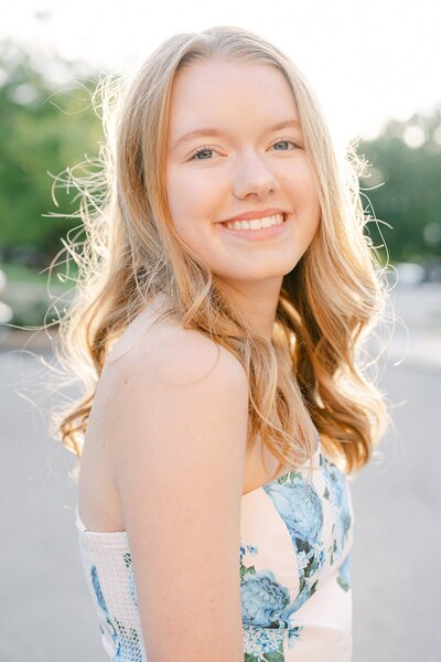 portrait of a girl with sun highlighting her hair during her senior session