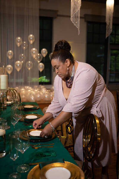 Luxury wedding planner Angela meticulously designs a stunning wedding reception setup in Raleigh, NC.