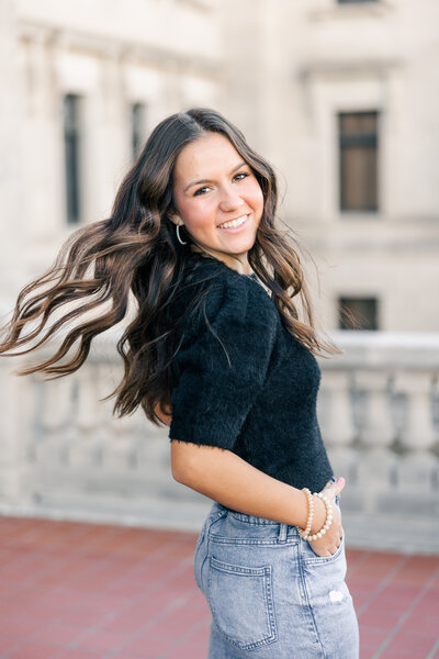 girl smiling while tossing her hair