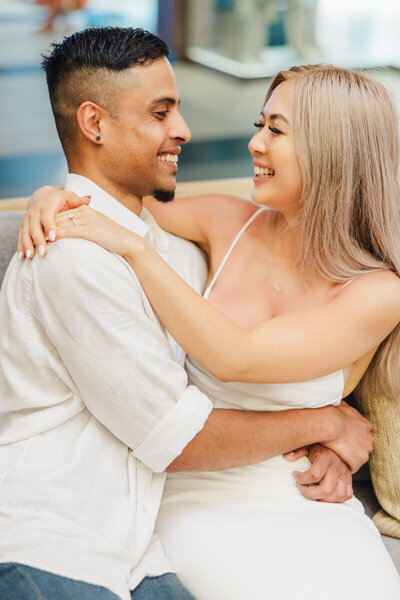 engaged couple with girl sitting on his lap