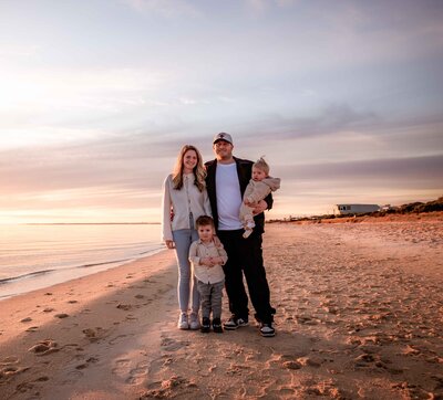 Family of four photographed on a Melbourne beach at sunset