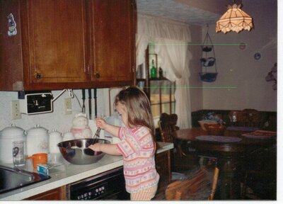 kid mixing cake batter in the kitchen in the early 1990s