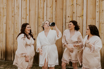 champagne spray with bride and bridesmaids