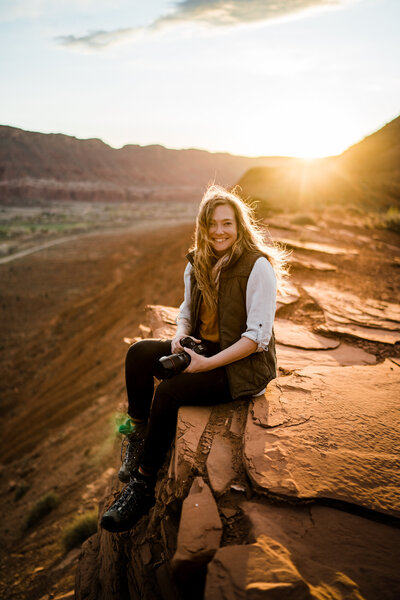 the adventure wedding and elopement photographer aimee flynn dances in Moab