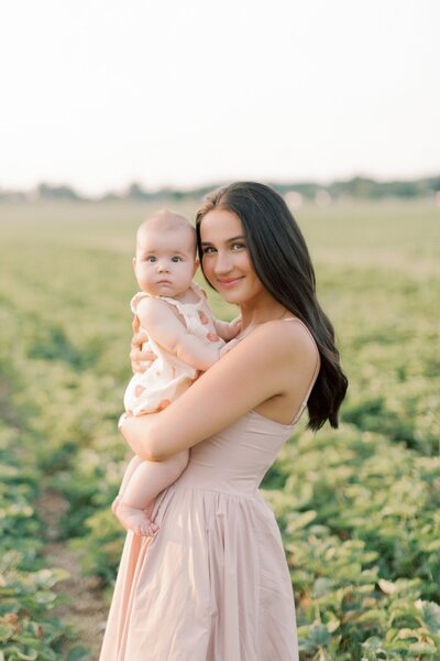 Family walking together on a field lane