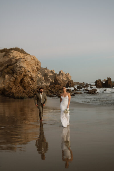 outdoor elopement photo of bride and groom holding hands