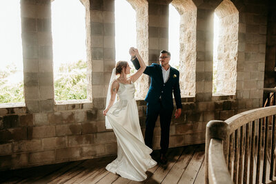 Intimate private moment between the couple inside a St. Augustine castle venue.