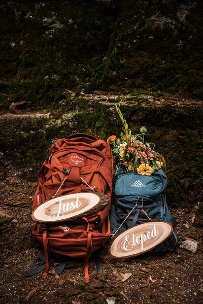 bride and groom backpacks