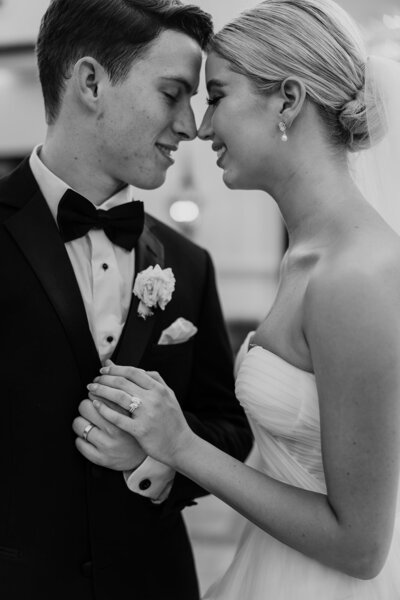 Black and white photo of a newlywed couple by KC wedding photographer Abbey Regnier.