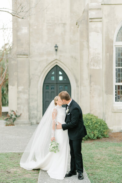 couple embracing  after their ceremony at their charleston wedding day