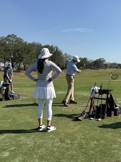 Renee O’Higgins, PGA and LPGA golf instructor giving a golf lesson at Quail West in Naples, Florida.