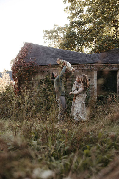 Family photo session in a field