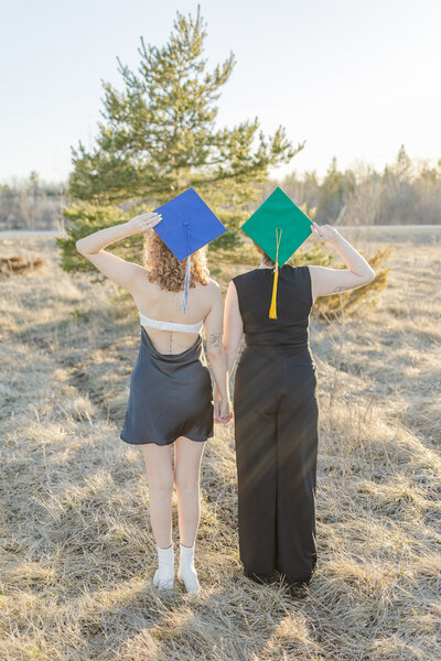 thumbnail photo of two sisters in their graduation caps