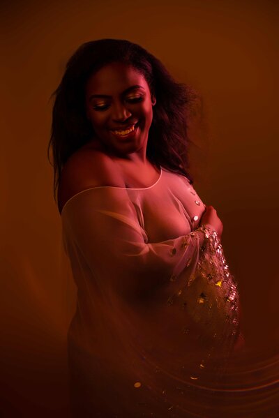 Los Angeles Luxury Maternity Photographer - Mom draped in colors wearing a mesh jeweled cape