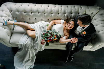 Bride and Groom sitting on the couch at Terminus 330 in Atlanta