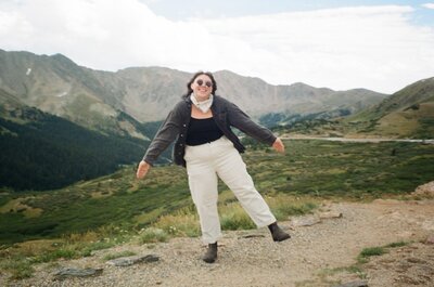 A portrait of Colorado elopement photographer, Rachel Kobernik at Loveland Pass