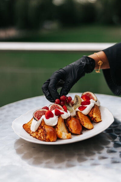 Hand-decorated desert with fresh fruits on display