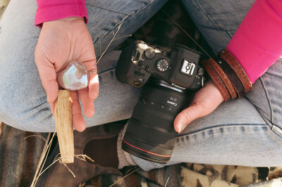 hippie photographer with crystals and palo santo 