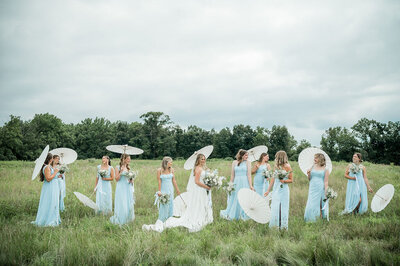 Wedding couple in the field near forest wedding venue in PA.