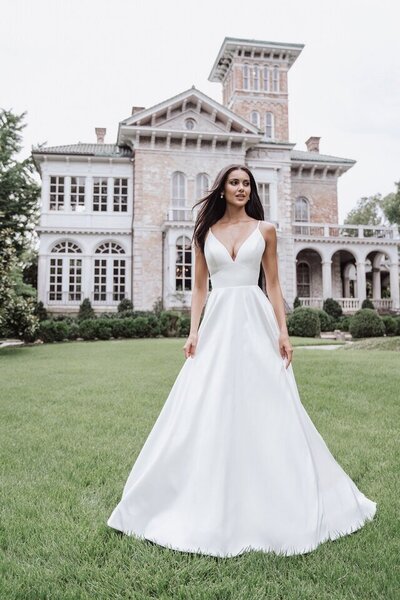 Windblown leaves are featured across the bodice of this ballgown.