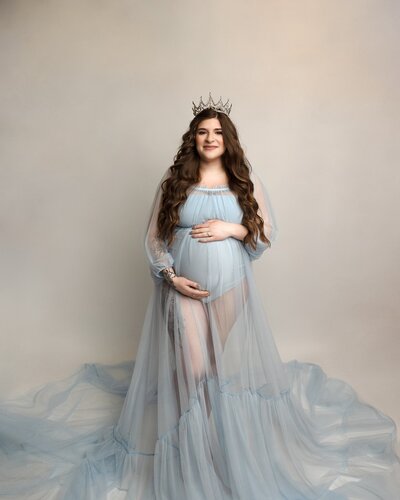 expecting mom in blue dress for maternity session near portland oregon