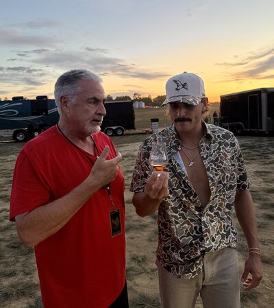 Chuck Swaney + Tucker Wetmore sipping whiskey