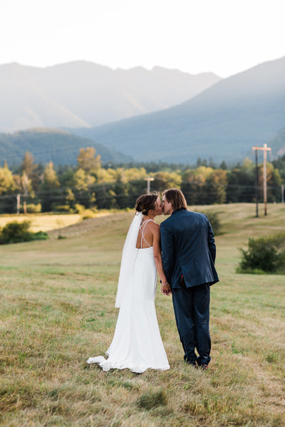 a couple kisses at sunset after their elopement near Olympic National Park