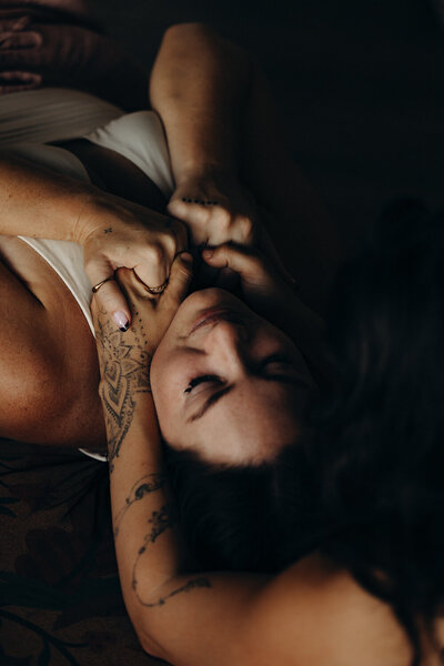 Relaxed brand portrait captured by Sunshine Coast photographer, featuring a woman enjoying coffee in a soft-lit setting.
