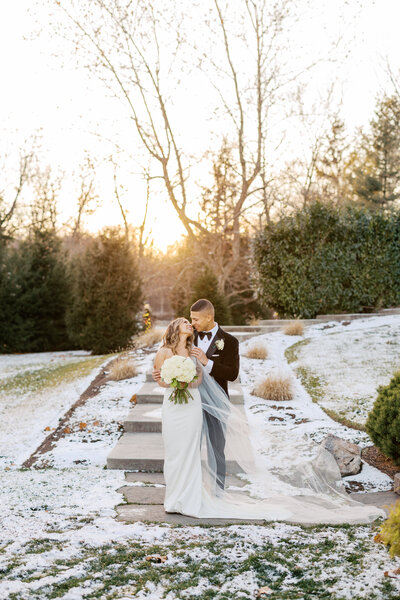 Bride and groom laughing joyfully during reception, captured by Indianapolis wedding videographer For All Time Films