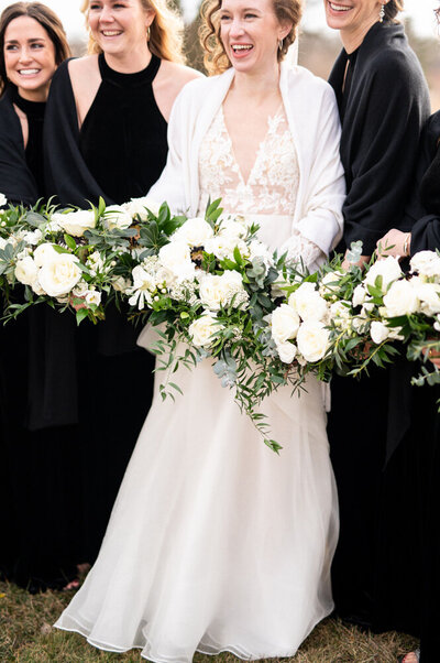 Bride and bridesmaid with bouquets