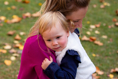 Toddler hugging mum