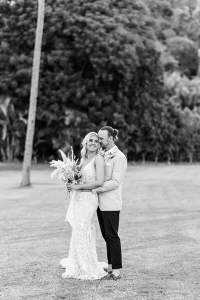 Black-and-white portrait of newlyweds at their Whitsunday weddings by Alyce Holzy
