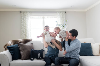 mother kissing her son during family photo shoot