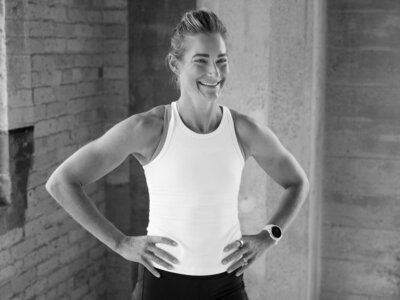 Lululemon ambassador runner posing and smiling, showcasing energy and authenticity during a brand photography session.