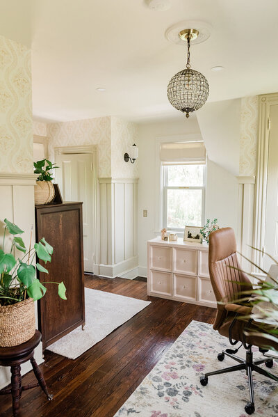 A view of a home office makeover featuring furniture flips and board and batten trim.